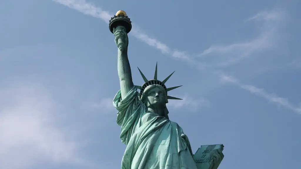 what idea does the torch on the statue of liberty represent